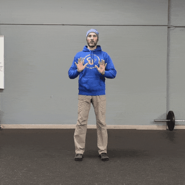 Coach Ryan demonstrates how the elbows naturally move when narrowing or widening the hands.