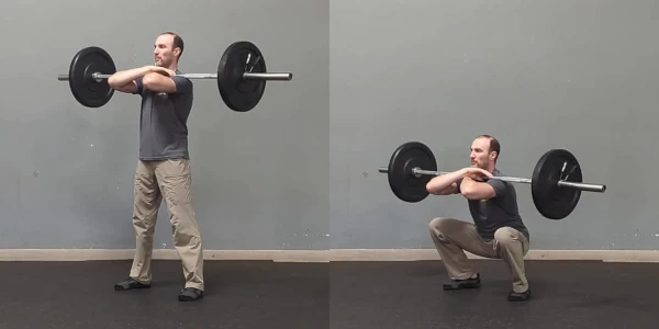 Coach Ryan demonstrates a barbell front squat.