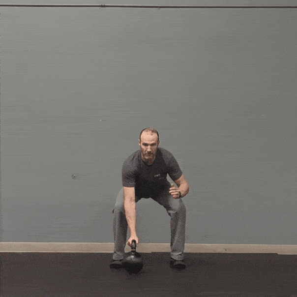 Coach Ryan demonstrates a kettlebell bottom-up press.