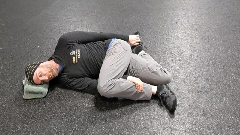 Coach Ryan demonstrates bad leg position during the Brettzel.