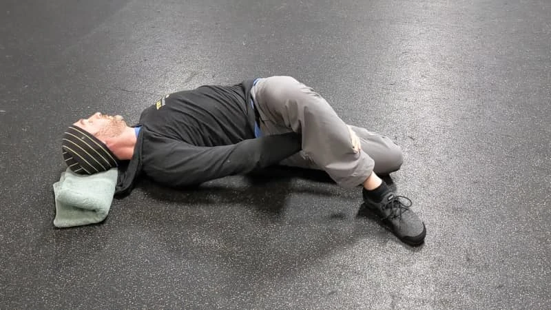 Coach Ryan demonstrates tilted hips—a suboptimal position—during the Brettzel.