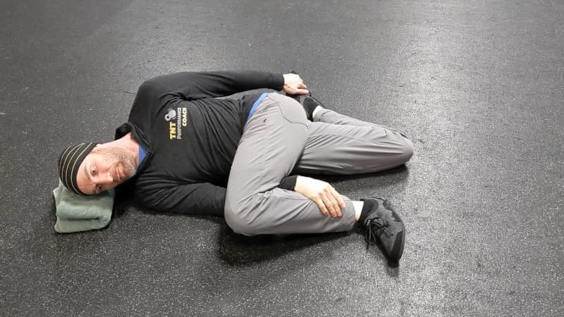Coach Ryan demonstrates good leg position during the Brettzel.