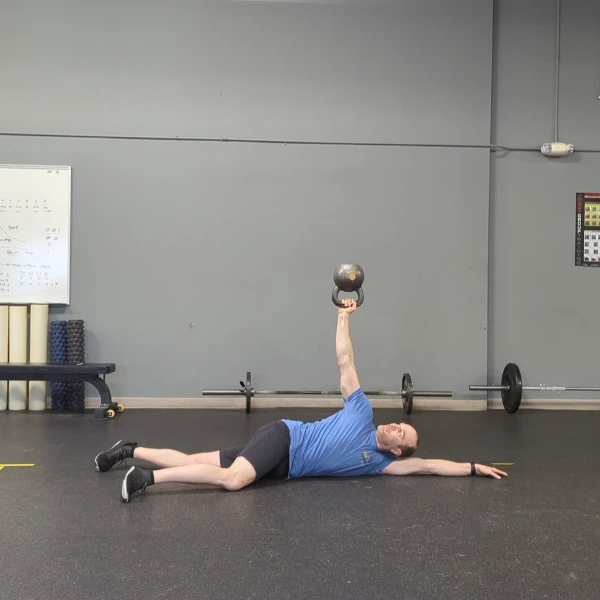 Coach Ryan demonstrates a kettlebell bottom-up arm bar.