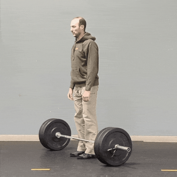 Coach Ryan demonstrates a barbell deadlift without wedging (not the recommended practice).