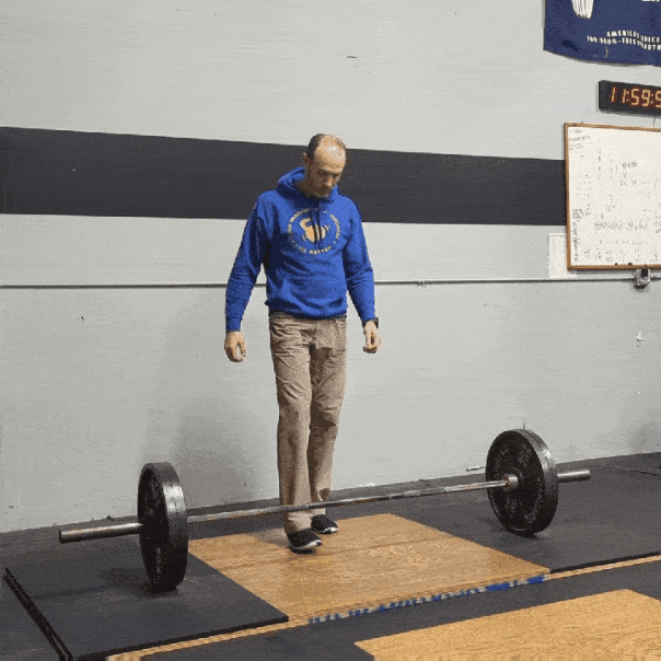 Coach Ryan performing a warm-up deadlift