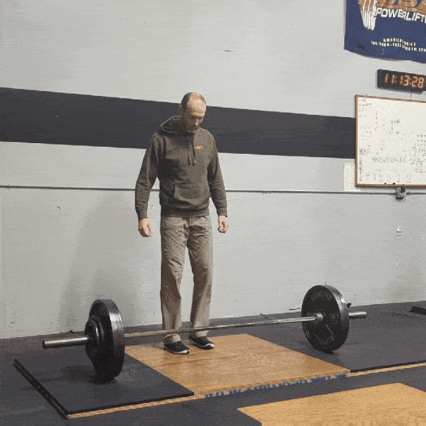 Coach Ryan performing a deadlift during a training session