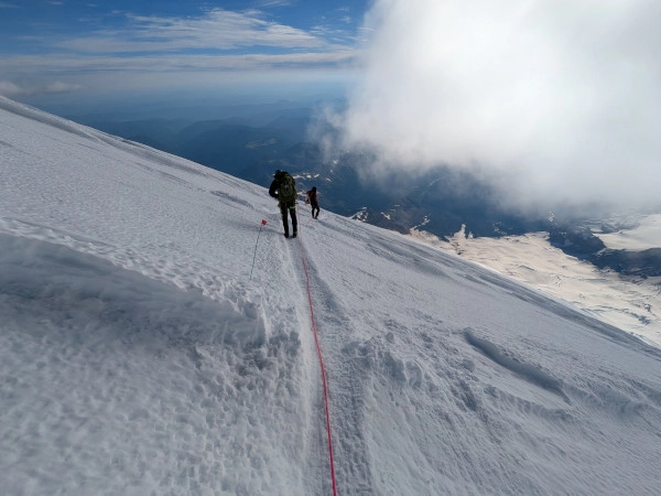 Coach Ryan's two climbing partners descend Mt. Rainier.