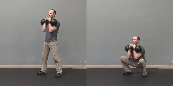 Coach Ryan demonstrates a double kettlebell front squat.