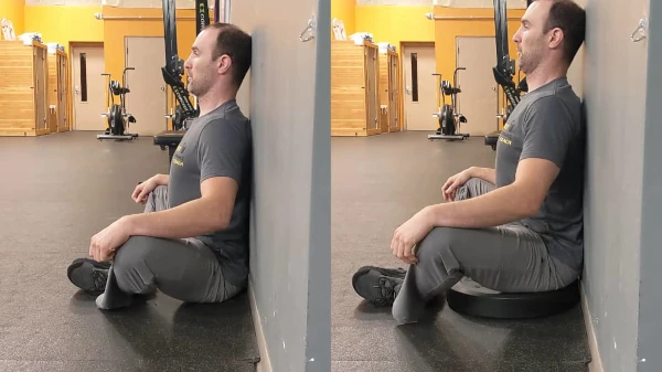 Coach Ryan demonstrates both the FMS Wall Sit and a modified version.