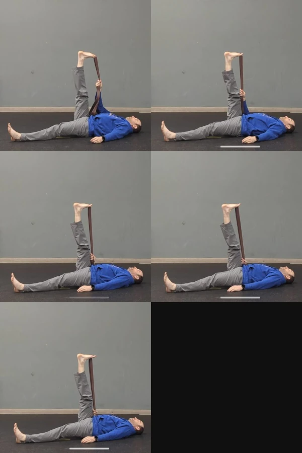 Coach Ryan demonstrates a belt-assisted single-toe stretch.