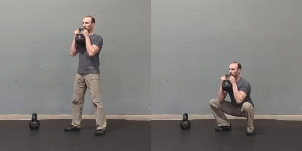 Coach Ryan demonstrates a kettlebell goblet squat.