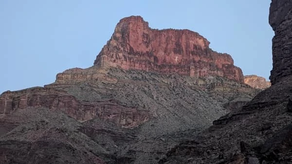 A view of a prominent rock ridge taken from the bottom of the Grand Canyon.