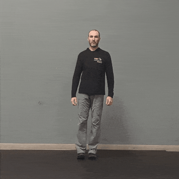 Coach Ryan demonstrates leg movement in the transverse plane with hip internal and external rotation.