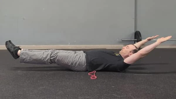 Coach Ryan demonstrates a bad—back is arched—hollow position.