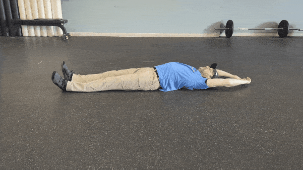 Coach Ryan demonstrates hollow body rolling.