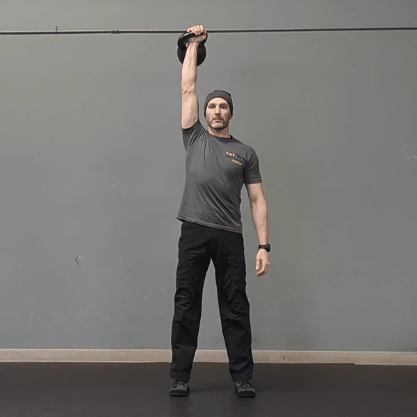 Coach Ryan demonstrates a Military Press using the medial grip.