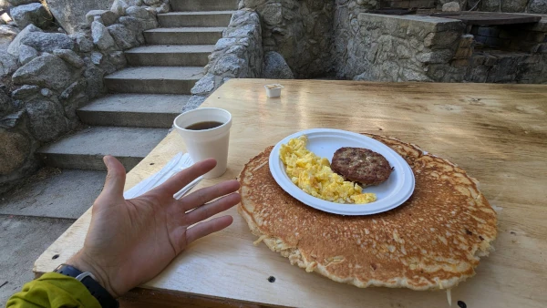 Coach Ryan's late breakfast after descending to the park entrance from the summit of Mt. Whitney—coffee, scrambled eggs, a sausage patty, and a 15" pancake.