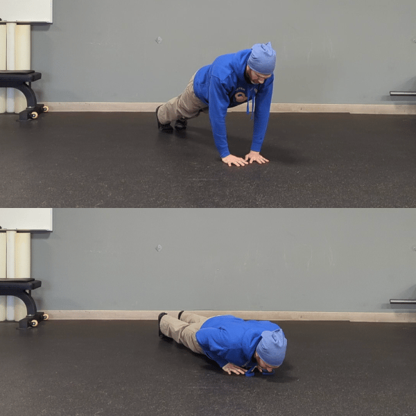 Coach Ryan demonstrates a pushup position with hands narrower than his shoulders.
