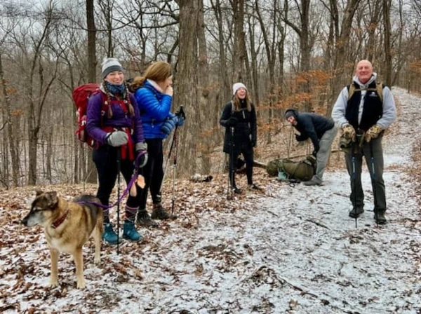 Members of the TNT hiking club taking a break on the trail during the 2024 New Year's Day hike.