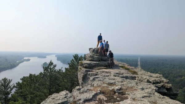 att-image-align-caption-center Coach Ryan along with his brother and a few friends standing atop Petenwell Bluff