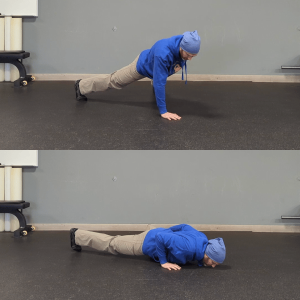 Coach Ryan demonstrates a one-arm pushup position.