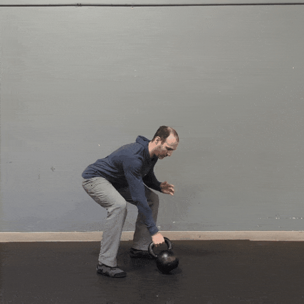 Coach Ryan demonstrates one-hand swings.