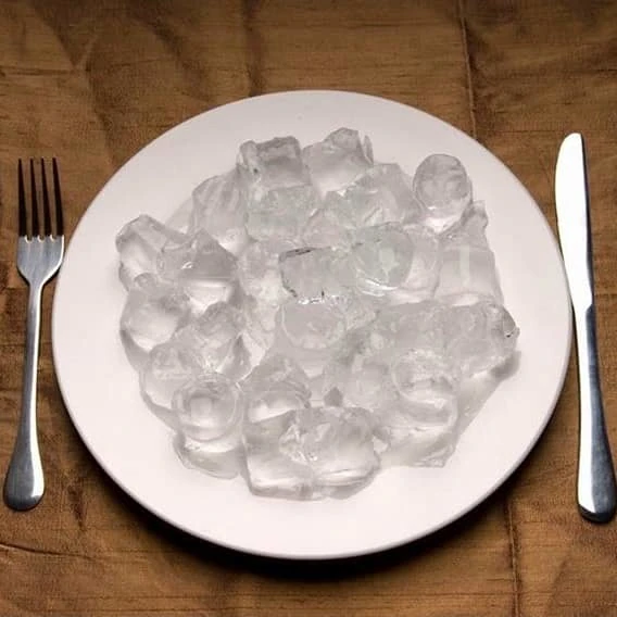 A plate full of ice cubes.