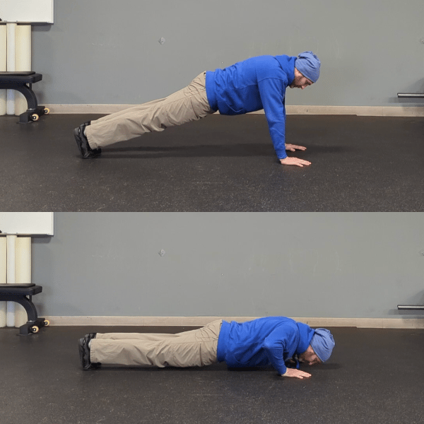 Coach Ryan demonstrates the top and bottom pushup position with hands that are too far forward.
