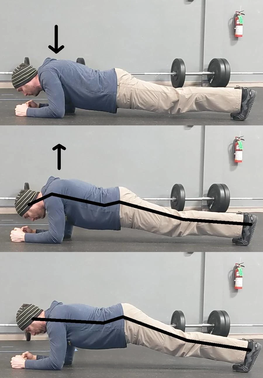 Coach Ryan demonstrates a suboptimal plank position: sagging head, sagging shoulders, and arched (lower) back.