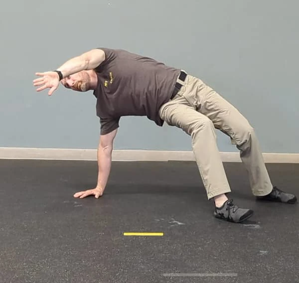 Coach Ryan demonstrates a common T-spine Bridge mistake—rotating the hips.