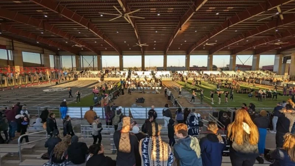 CrossFit athletes competing on a field at The Fittest Experience