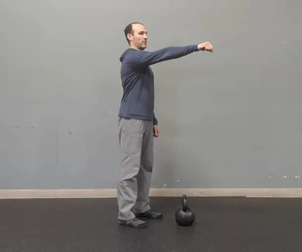 Coach Ryan demonstrates an unpacked shoulder.