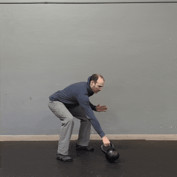 Coach Ryan demonstrates unpacked shoulders while doing swings.