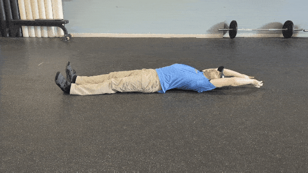 Coach Ryan demonstrates rolling by using only his upper body.