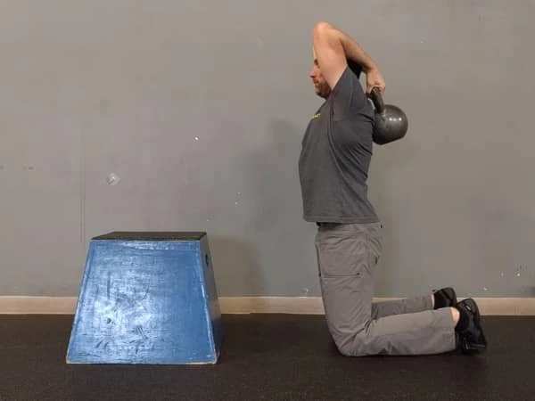 Coach Ryan demonstrates how to set up for the Weighted T-spine Stretch.