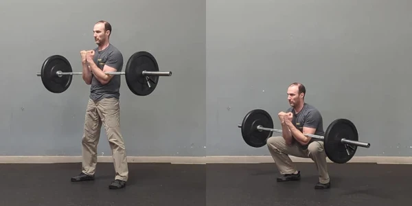 Coach Ryan demonstrates a Zercher squat.